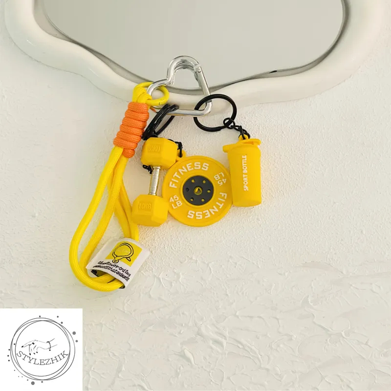 چارم بگ فیتنسی زرد طرح دمبل، وزنه و شیکر | آویز کیف ورزشی شاد و ترند